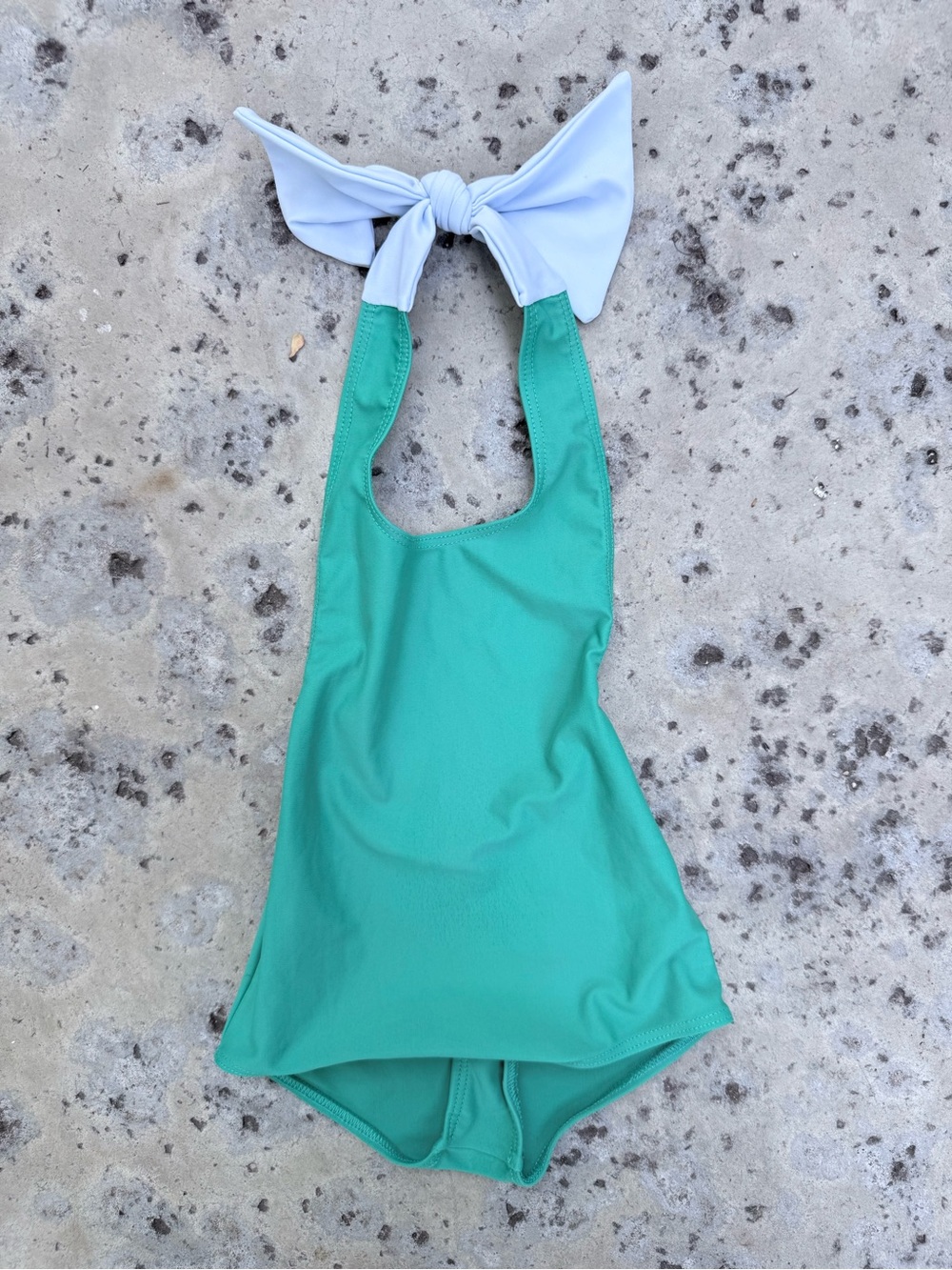 Canopea Kids Green One-Piece Swimsuit with White Bow- halter, UPF 50 protection.